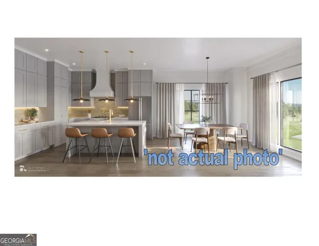 a living room with furniture a table and kitchen view