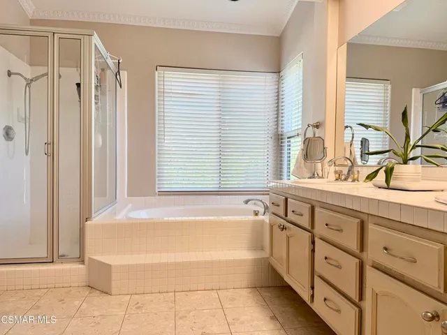 a bathroom with a bathtub and a sink