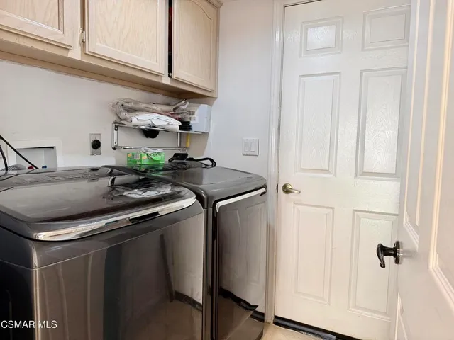 a kitchen with stainless steel appliances granite countertop a sink and a stove