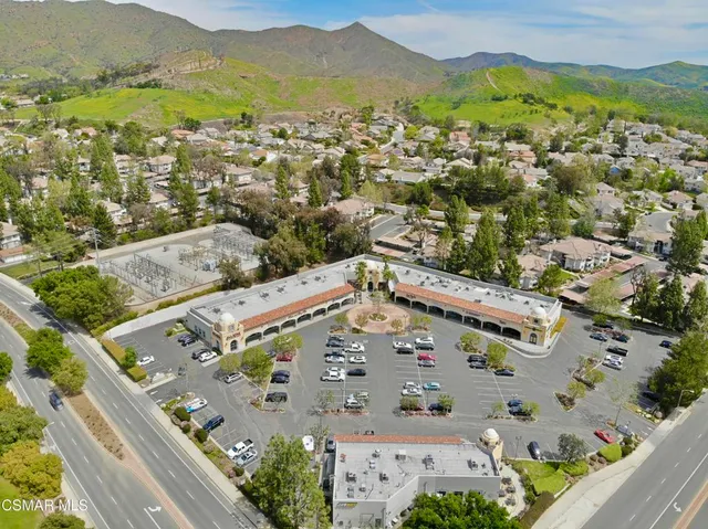 an aerial view of residential houses and outdoor space