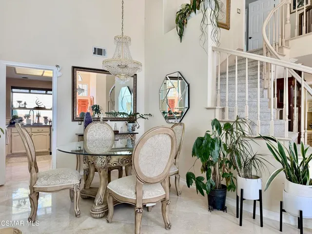 a view of a livingroom with furniture and a floor to ceiling window