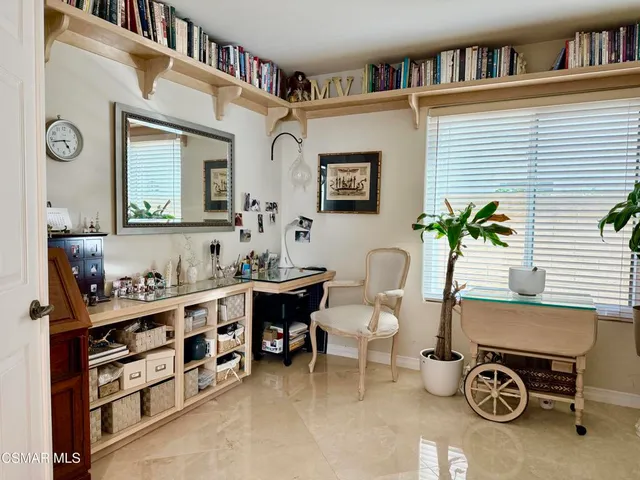 a view of a workspace with furniture