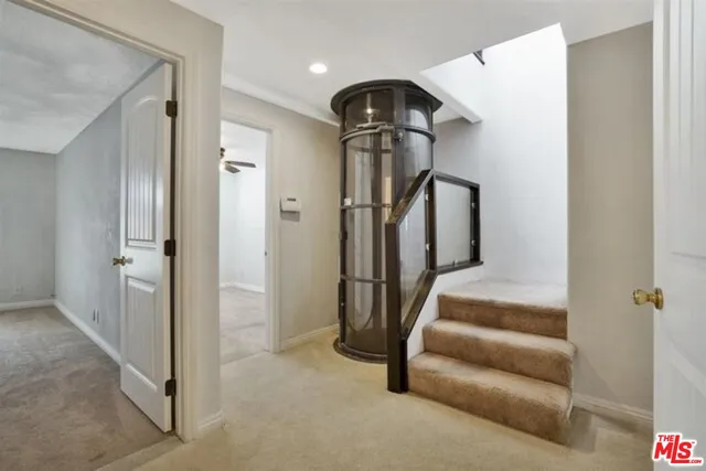 a view of entryway and hall with a hallway