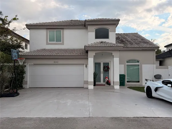 a front view of a house with a garage