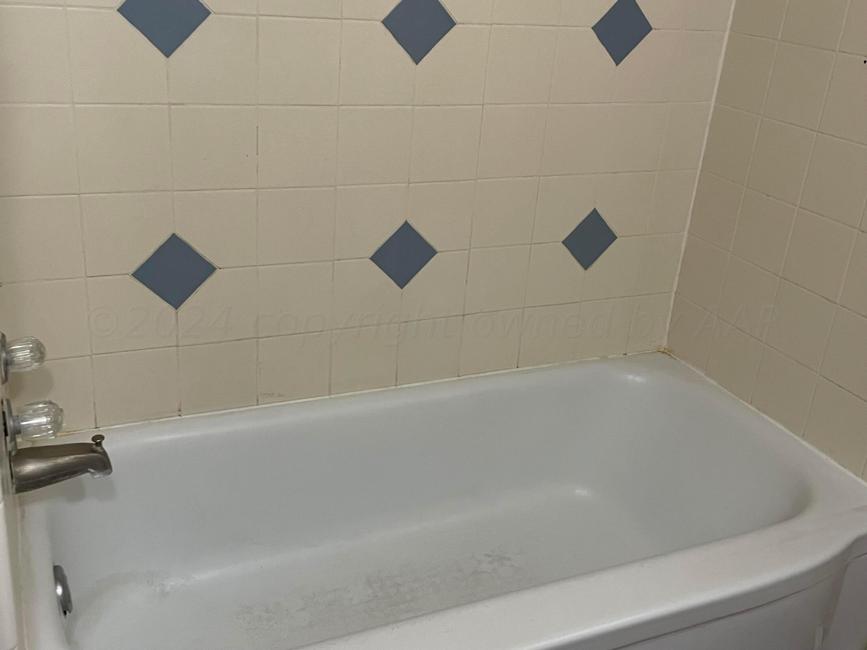 2014 South Drake Street Perryton, TX 79070 - Photo 10 of 10 a close view of a bathtub in a bathroom