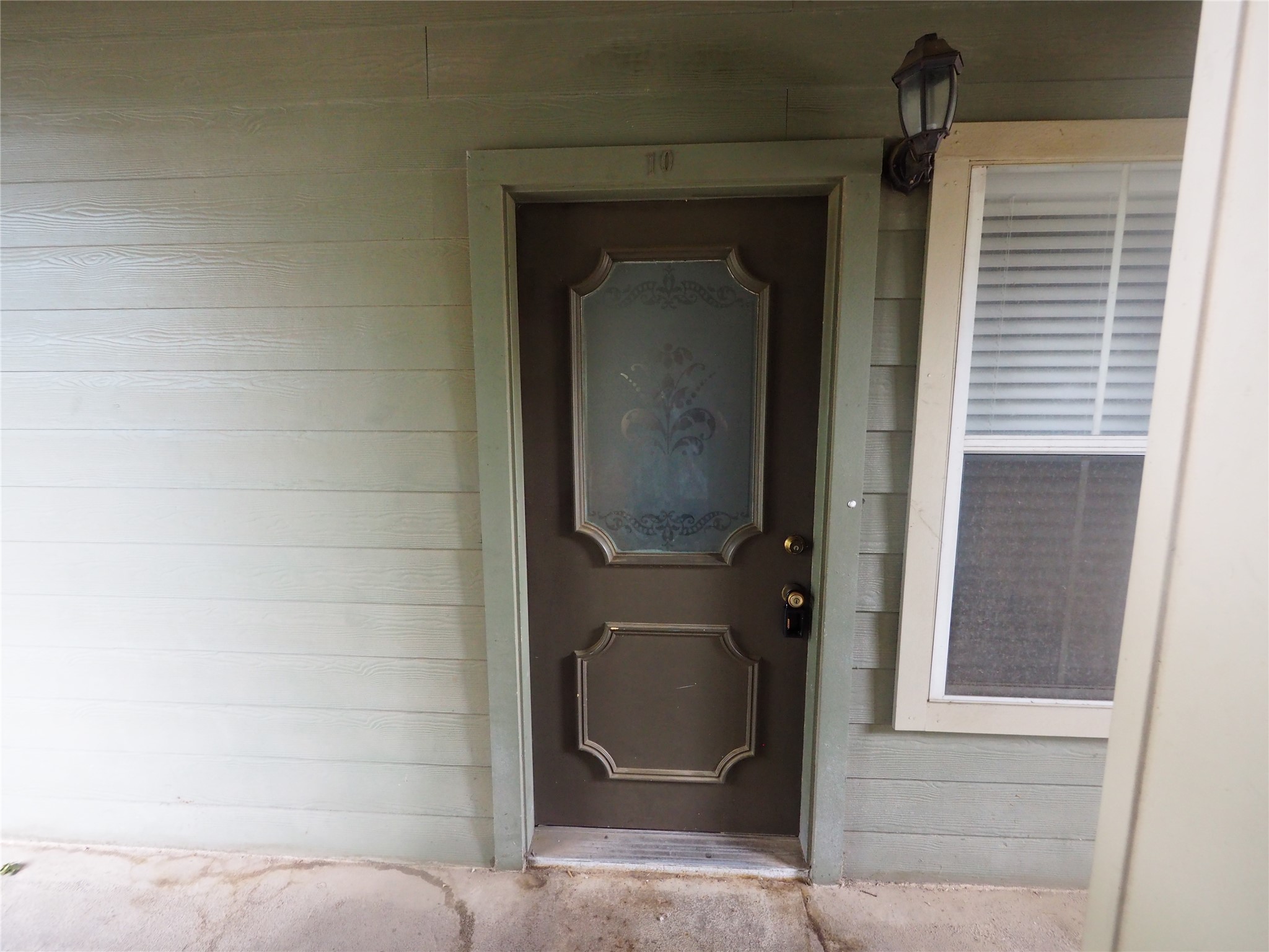2508 Enfield Road, Unit 10 Austin, TX 78703 - Photo 2 of 17 Entry door with decorative glass insert and paneled detailing