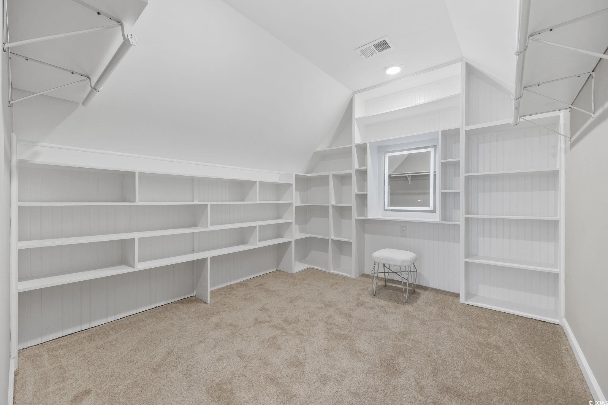 629 Slash Pine Court Myrtle Beach, SC 29579 - Photo 25 of 40 Spacious closet featuring light colored carpet and vaulted ceiling