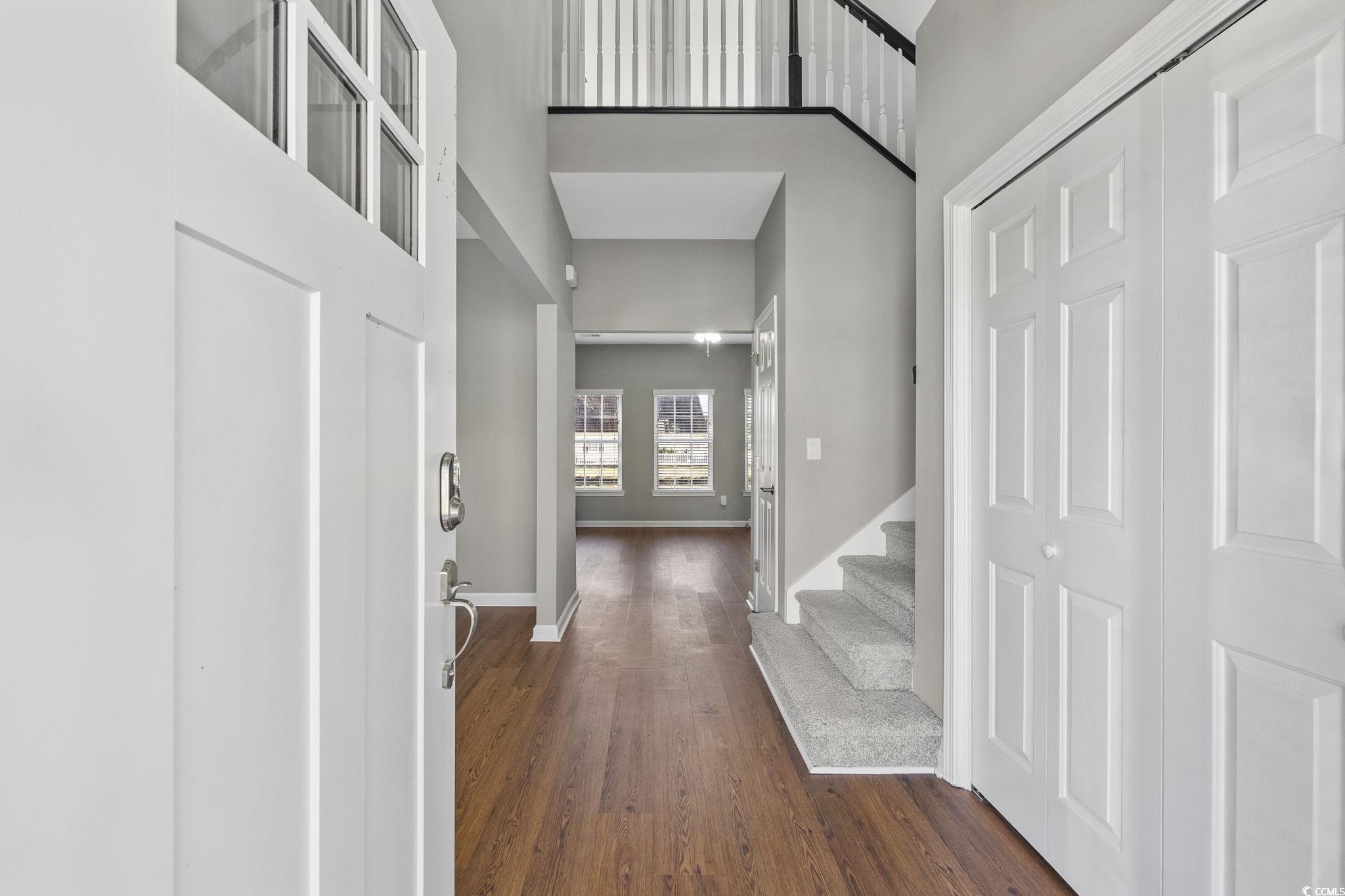 629 Slash Pine Court Myrtle Beach, SC 29579 - Photo 3 of 40 Foyer featuring a high ceiling, dark wood-style floors, and stairs