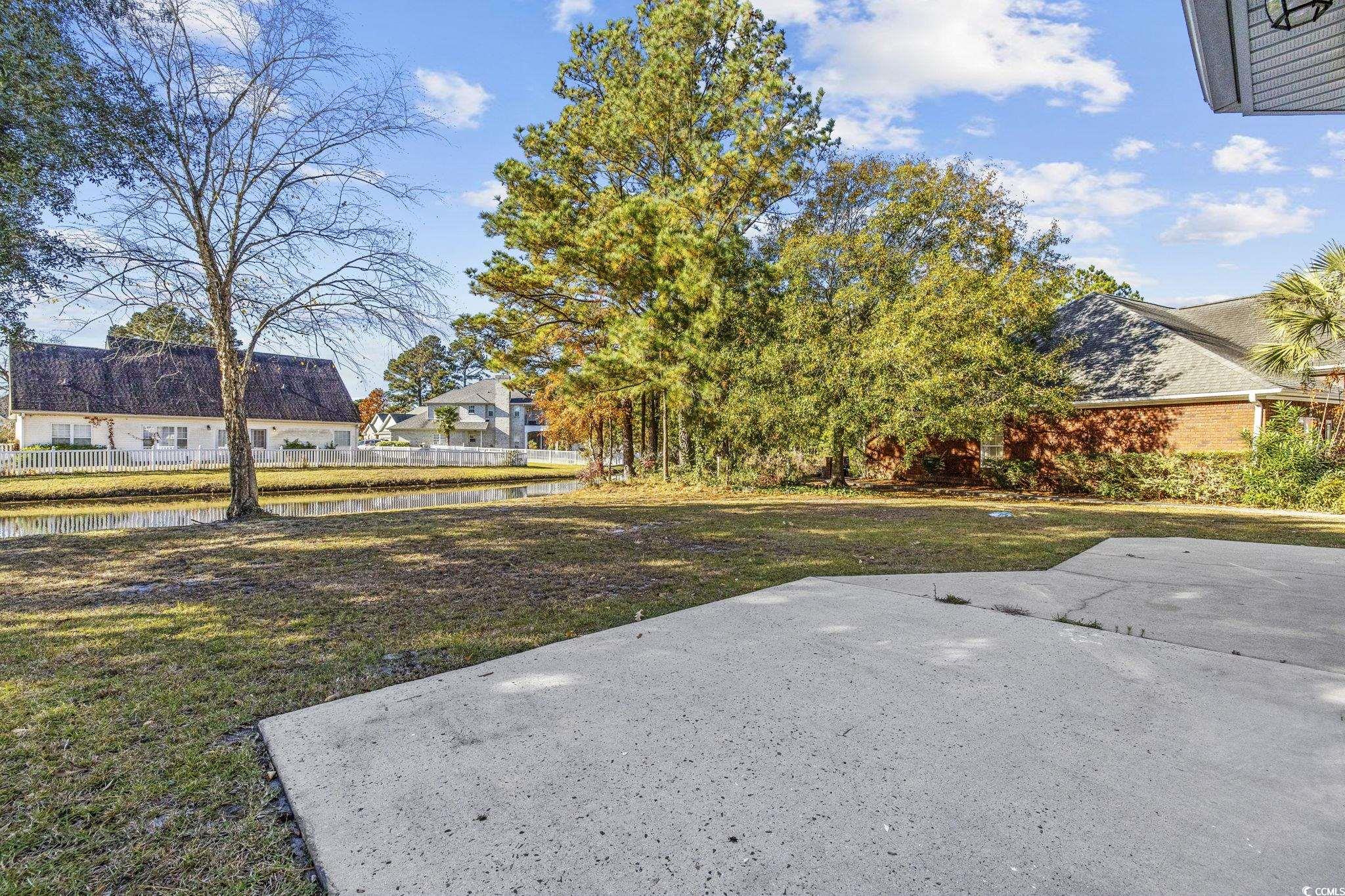 629 Slash Pine Court Myrtle Beach, SC 29579 - Photo 31 of 40 View of yard featuring a water view