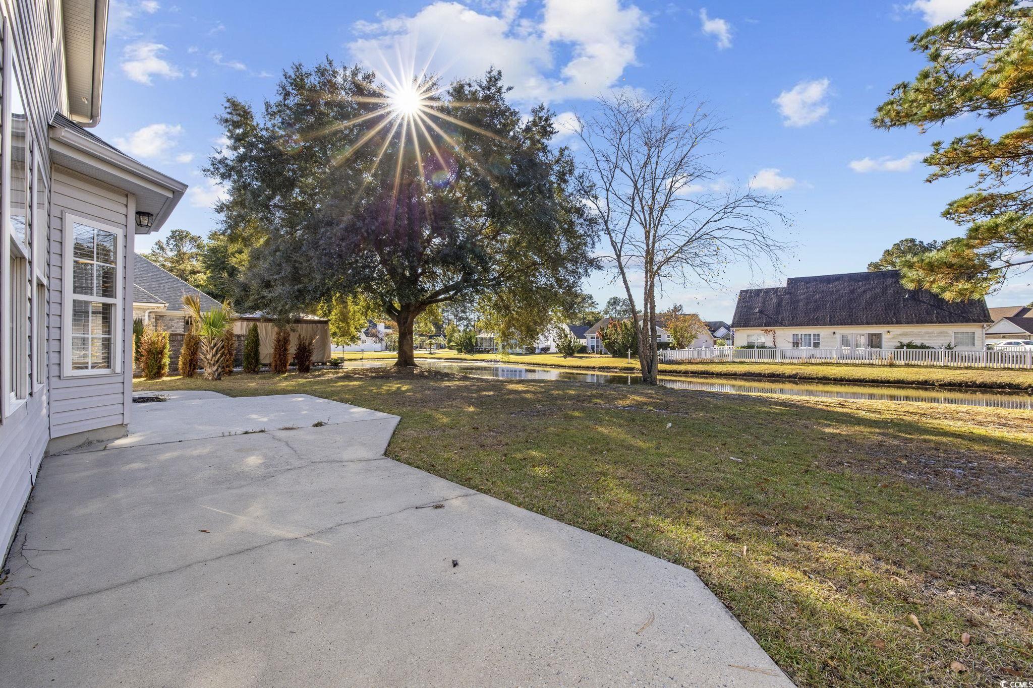629 Slash Pine Court Myrtle Beach, SC 29579 - Photo 32 of 40 View of yard with a patio area and a water view