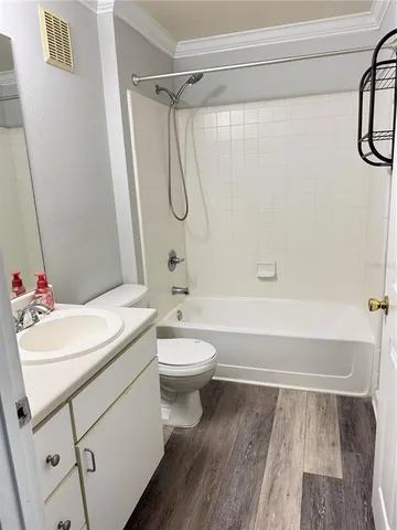 a bathroom with a sink a toilet and a bathtub