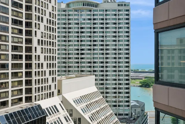 a view of a balcony with a barbeque
