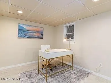 a view of a workspace with furniture