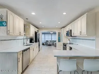 a kitchen with counter top space cabinets and a sink