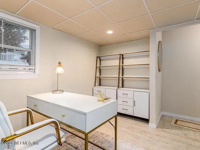 a room with a table and white walls