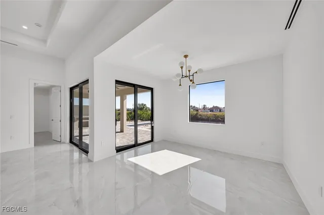 a view of a hallway with a chandelier
