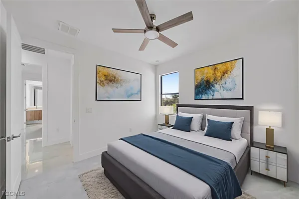 a view of a livingroom with a ceiling fan and window