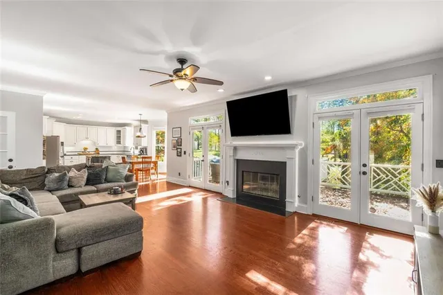 a living room with fireplace furniture and a flat screen tv