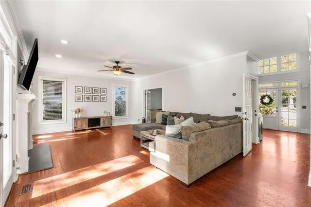 a living room with fireplace furniture and a flat screen tv