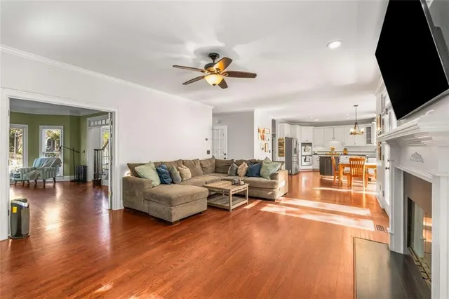 a living room with furniture fireplace and a flat screen tv