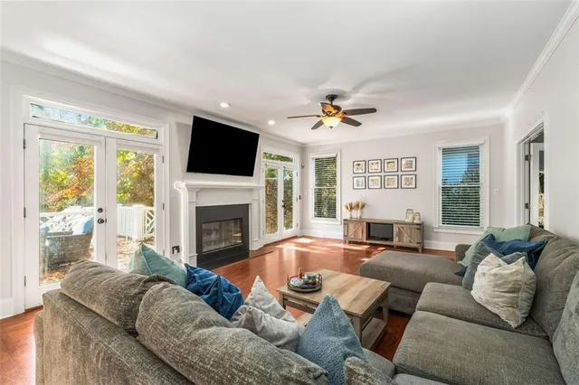 a view of kitchen with granite countertop wooden floor and a sink