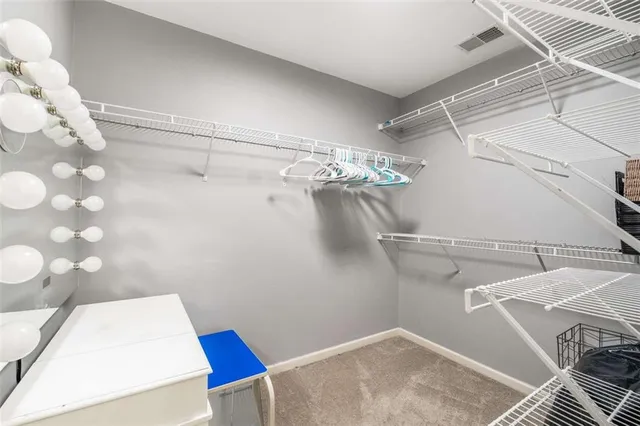 a spacious bathroom with a bathtub and a sink