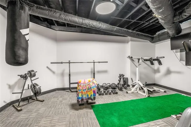 a utility room with cabinets washer and dryer
