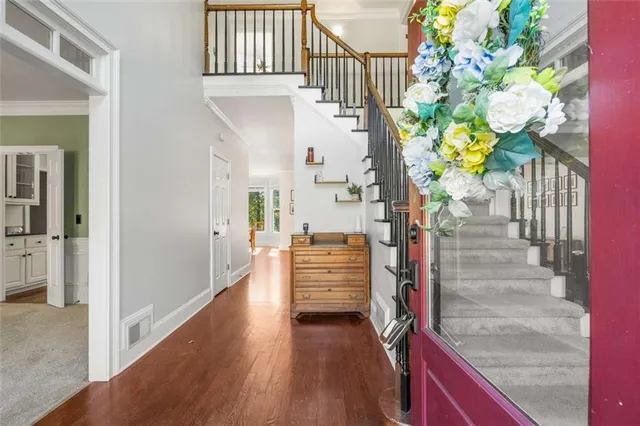 a kitchen with stainless steel appliances granite countertop a sink and a stove