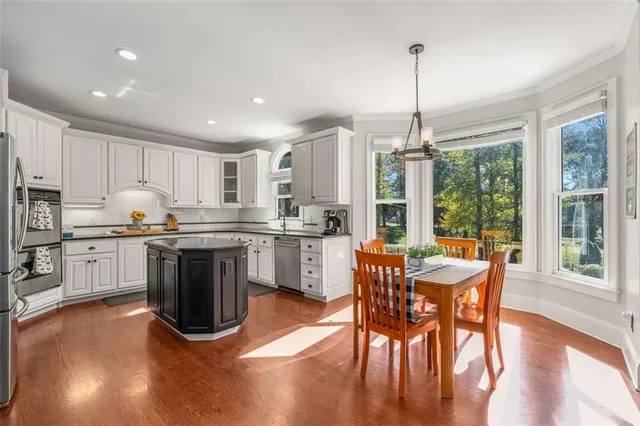 a view of a dining room with furniture window and outside view