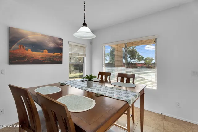 a kitchen with kitchen island granite countertop a sink counter top space appliances and cabinets