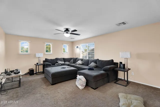 a kitchen with stainless steel appliances granite countertop a sink and a refrigerator