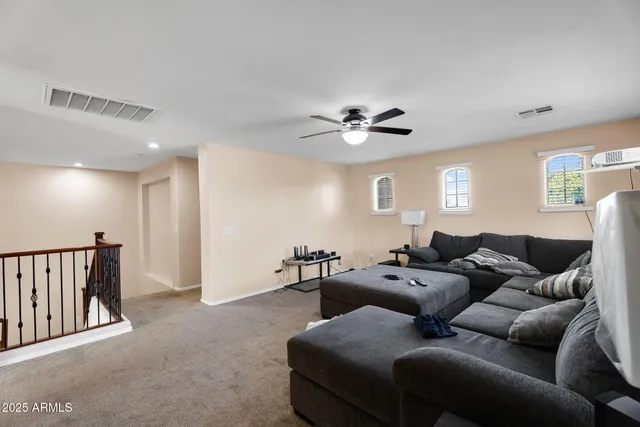 a dining room with furniture a window and a chandelier