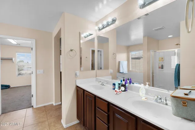 a bedroom with bed couch and couch