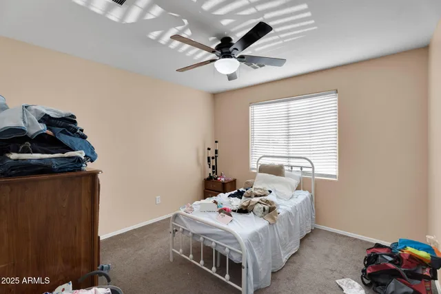 a spacious bathroom with a sink double vanity granite shower and a mirror