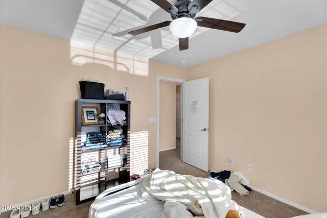 a bedroom with bed and a window