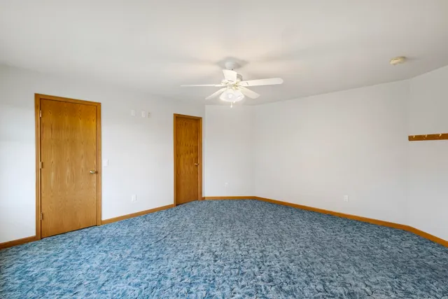 a view of a big room with carpet