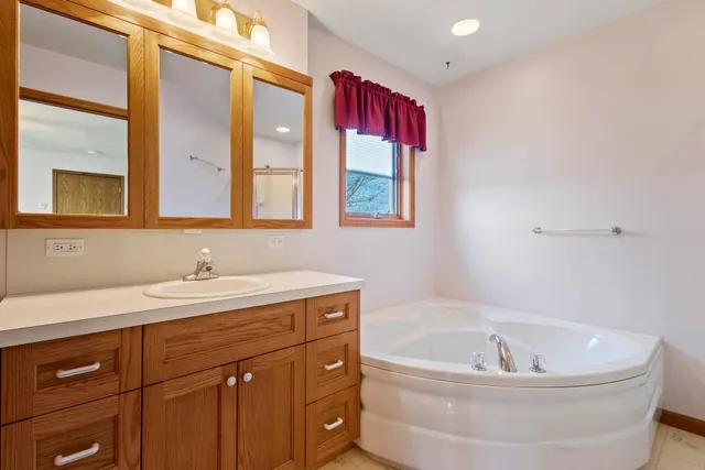 a bathroom with a bathtub and a sink