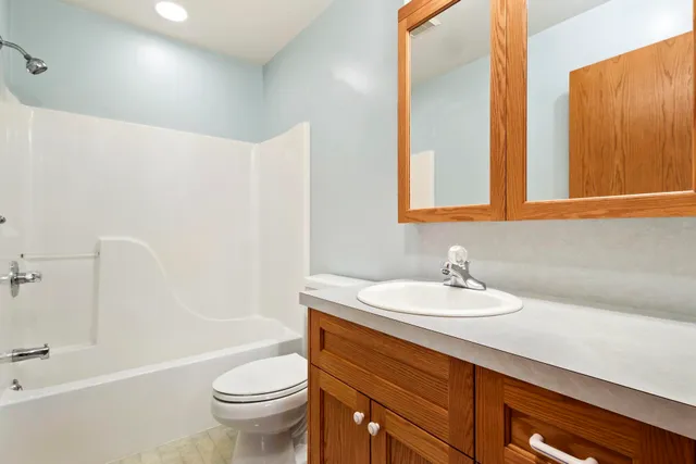 a bathroom with a sink a toilet and a bathtub
