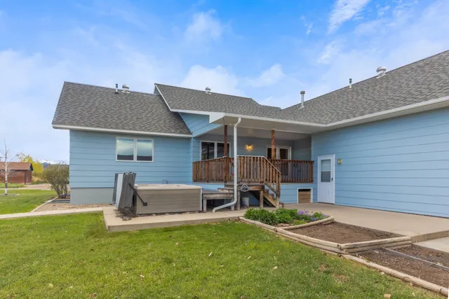 a view of a backyard with a garden and plants