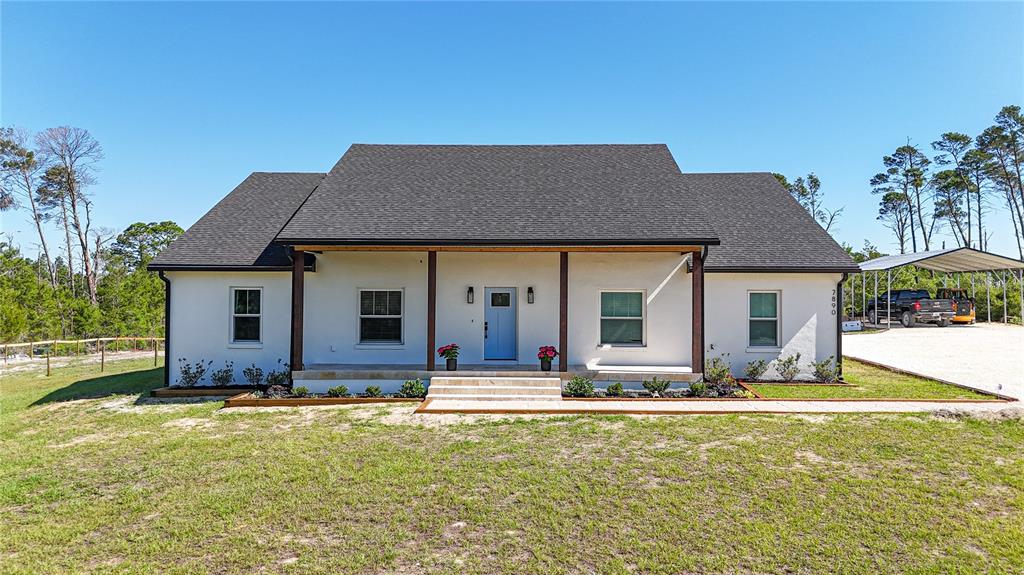 7890 Southwest 129th Avenue Cedar Key, FL 32625 - Photo 2 of 45 a front view of house with yard