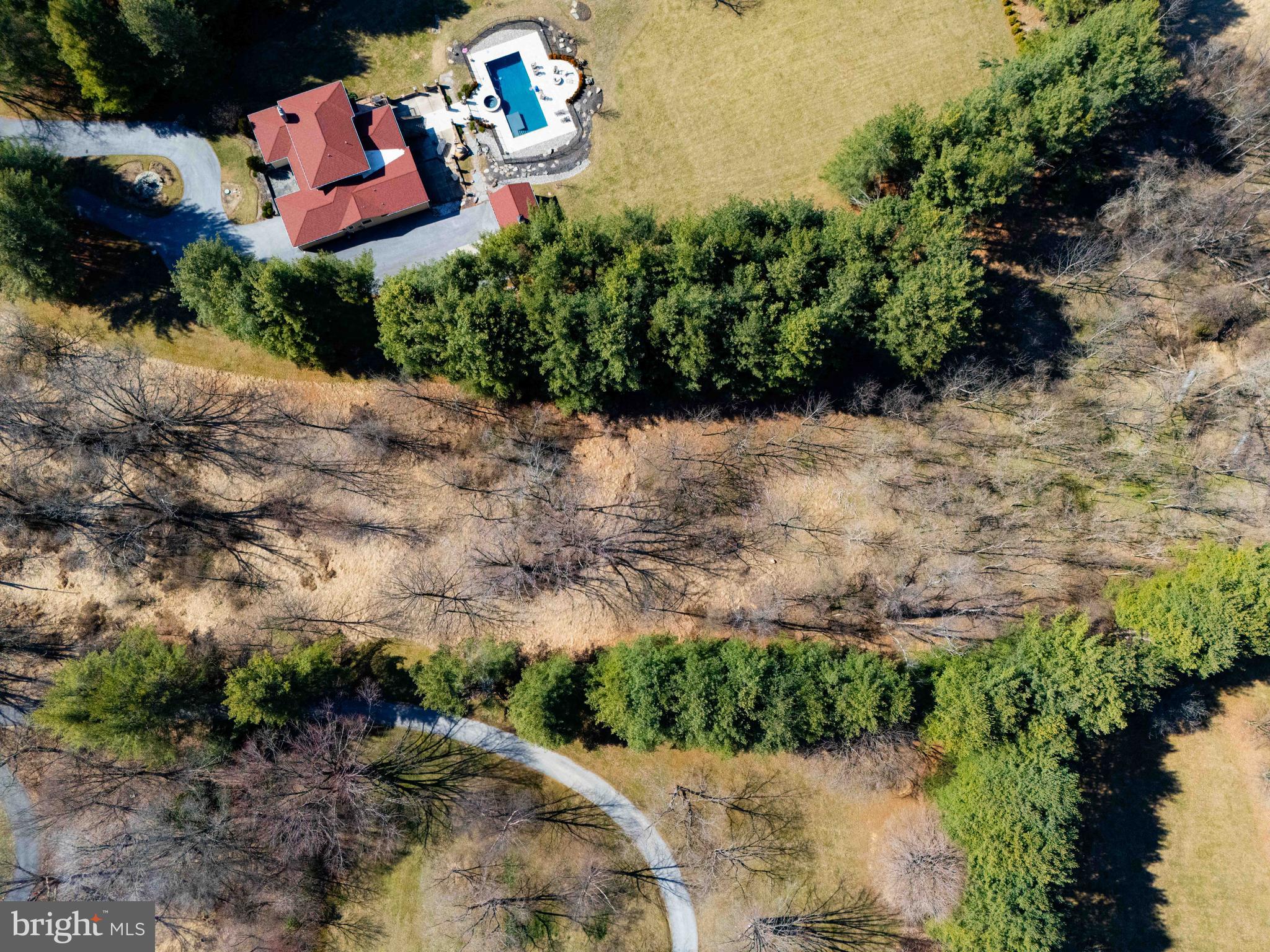 6031 Glen Arm Road East Glen Arm, MD 21057 - Photo 11 of 18 an aerial view of a house with a yard and lake