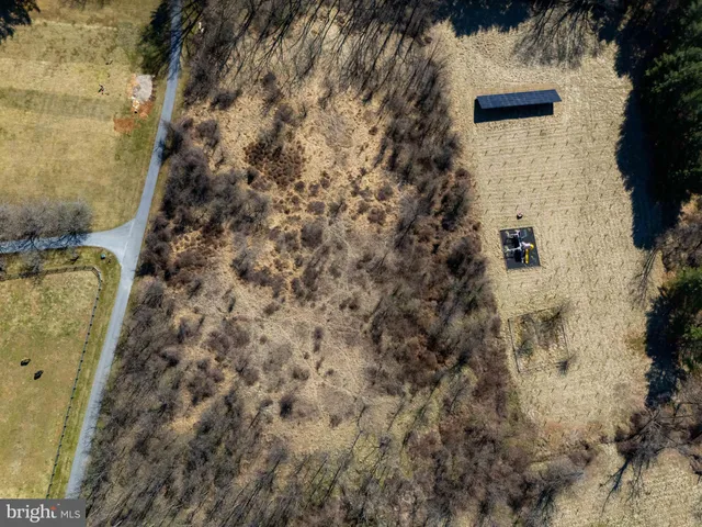 a view of a swimming pool with a yard