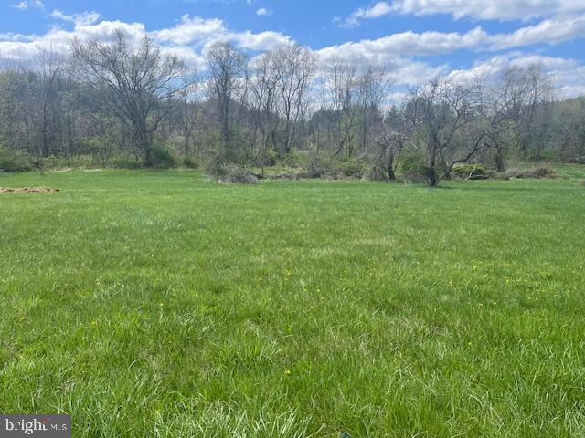6031 Glen Arm Road East Glen Arm, MD 21057 - Photo 2 of 18 a view of a field with trees in the background