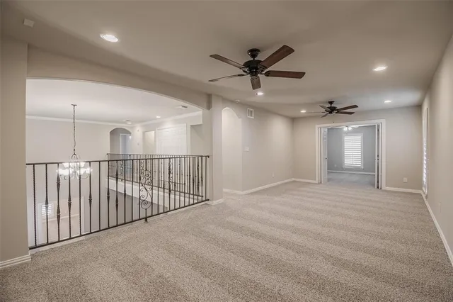 a view of a livingroom with a ceiling fan and window