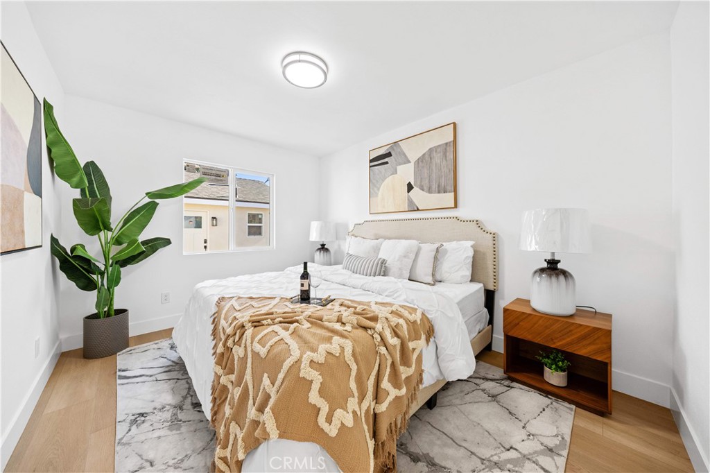 2274 Cogswell Road El Monte, CA 91732 - Photo 12 of 26 a bedroom with a bed and a potted plant