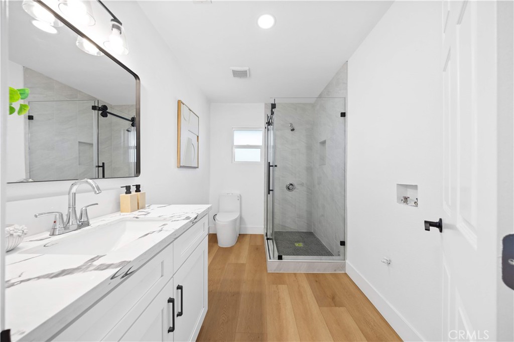 2274 Cogswell Road El Monte, CA 91732 - Photo 17 of 26 a spacious bathroom with a tub sink and mirror