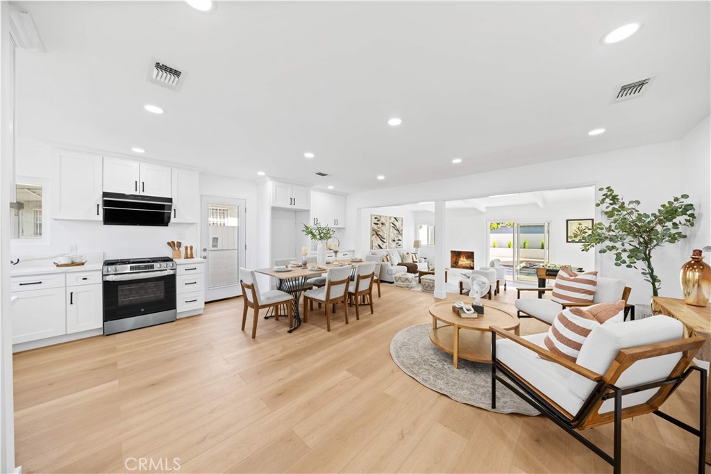 2274 Cogswell Road El Monte, CA 91732 - Photo 3 of 26 a living room with fireplace furniture and kitchen view