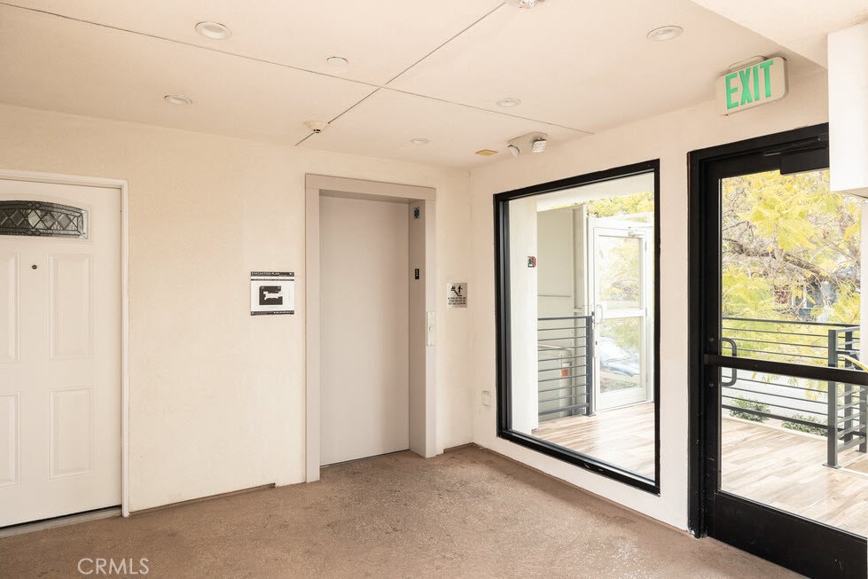 2651 South Hobart Boulevard, Unit 9 Los Angeles, CA 90018 - Photo 4 of 8 a view of a room with large windows