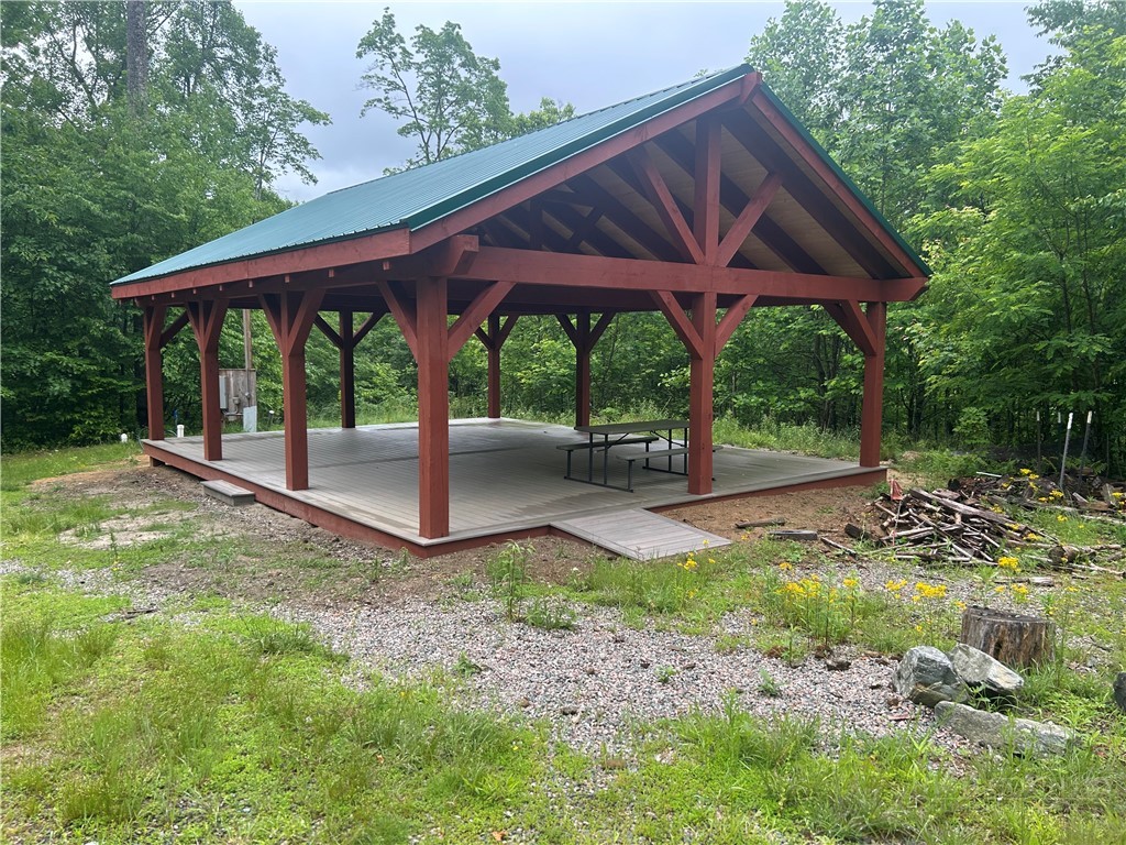Tbd Lot 48 Tbd Ridge Zionville, NC 28698 - Photo 13 of 18 a view of a patio with a table chairs and a backyard