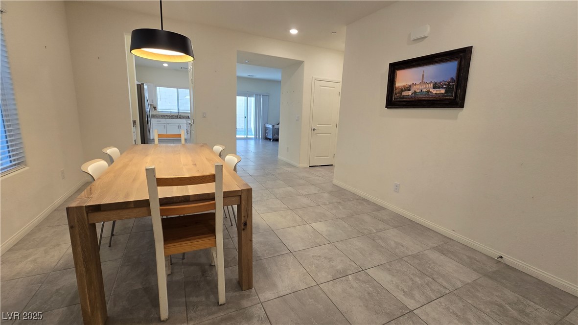 10971 Meridian Fields Avenue Las Vegas, NV 89166 - Photo 11 of 66 Dining area with light tile patterned flooring and recessed lighting